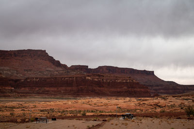 Picnic tables at hite marina campground in utah, usa during moody cloudy day