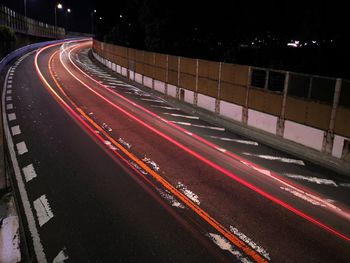 Light trails on road in city at night