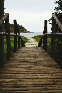 Pier over sea against sky