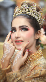 Close-up portrait of beautiful model wearing crown