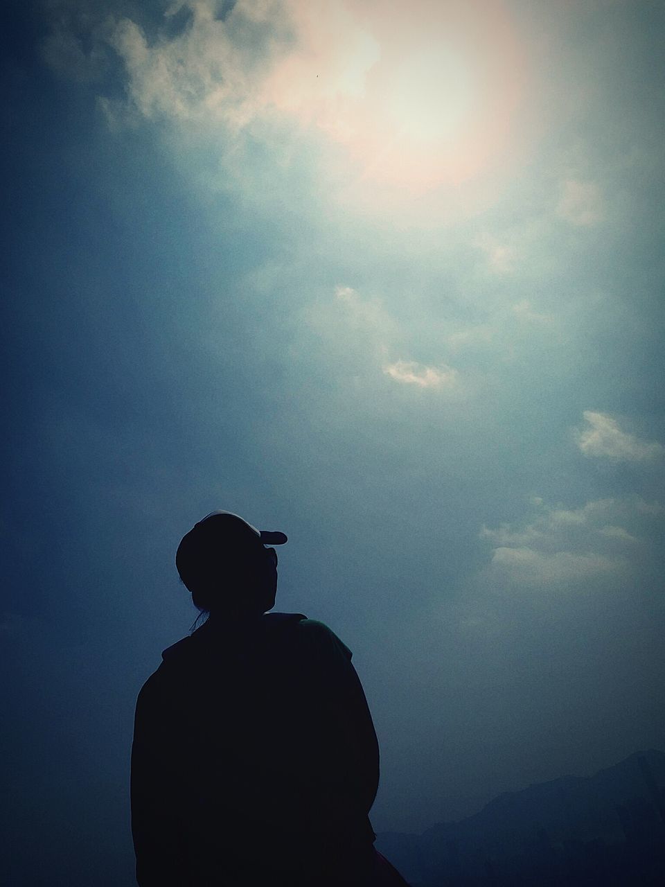 REAR VIEW OF SILHOUETTE MAN AGAINST SKY