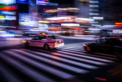 View of traffic on city street at night