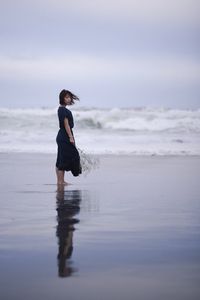 Woman standing on beach