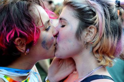 Portrait of young couple kissing