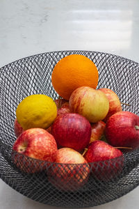 High angle view of fruits in basket on table