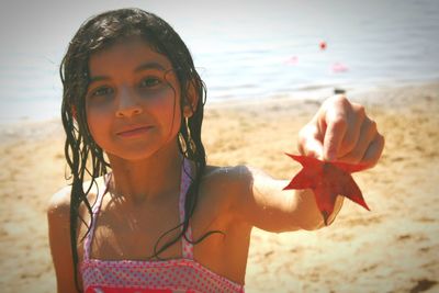 Portrait of girl standing on beach