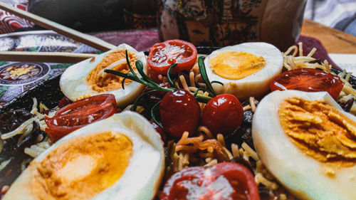 High angle view of eggs and noodles