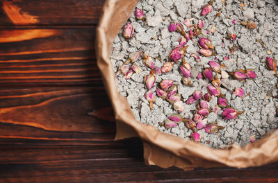 High angle view of pink bread on wooden table