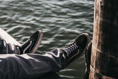 Low section of man relaxing in water