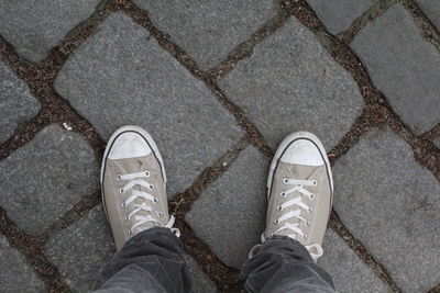 Low section of man standing on floor