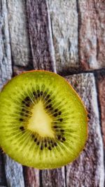 Close-up of lemon slice on wood