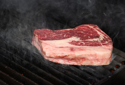 Close-up of meat on barbecue grill