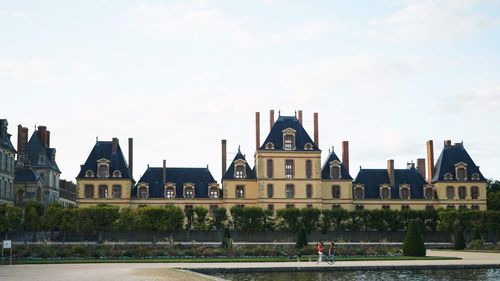 Buildings in city against sky