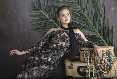 Portrait of young woman sitting outdoors