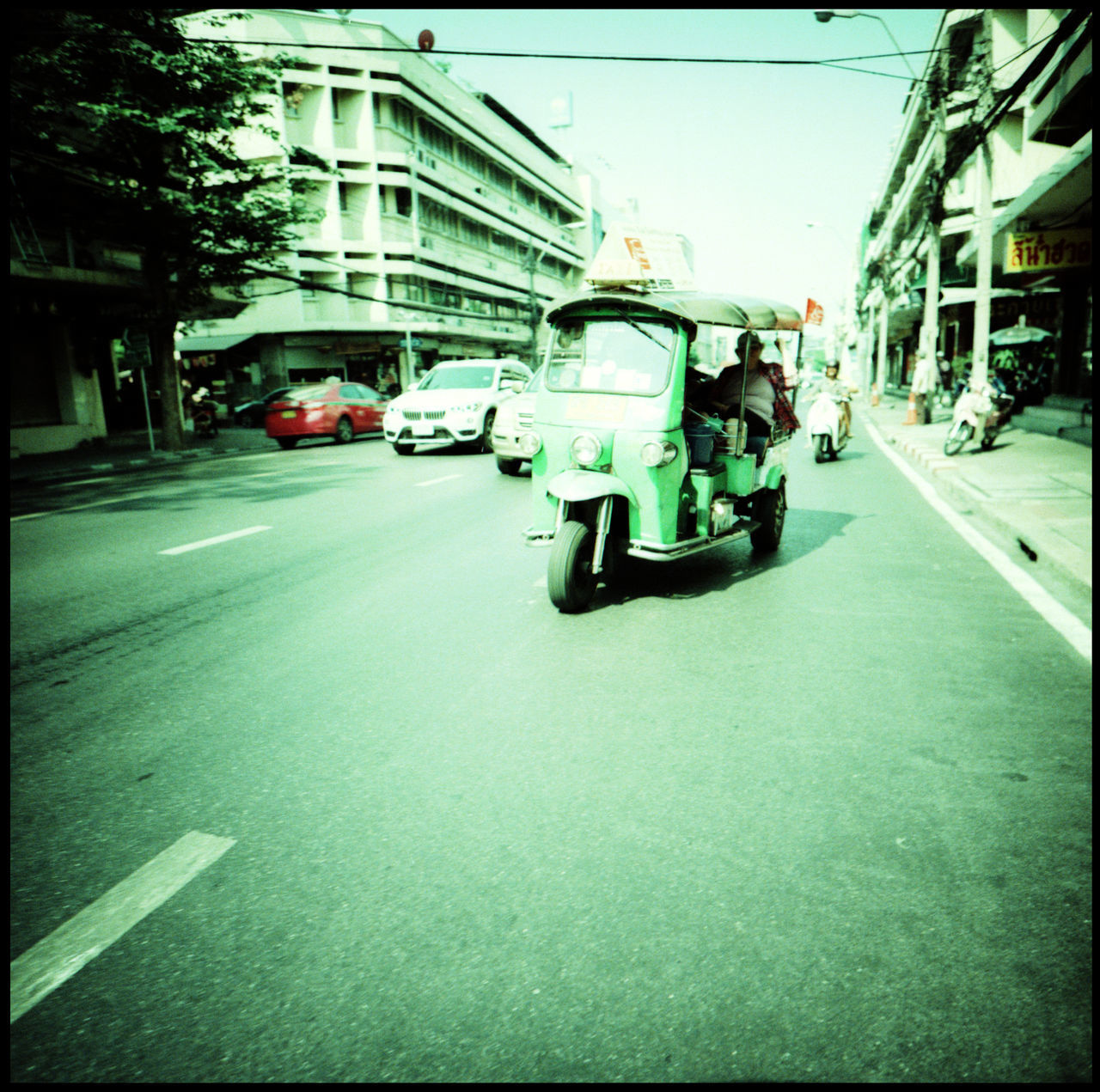 CARS ON STREET IN CITY