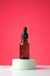 Close-up of bottle against yellow background