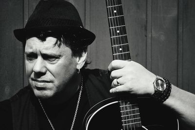 Portrait of man playing guitar