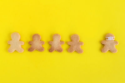 Close-up of cookies against yellow background