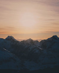 Scenic view of mountains against sky during sunset