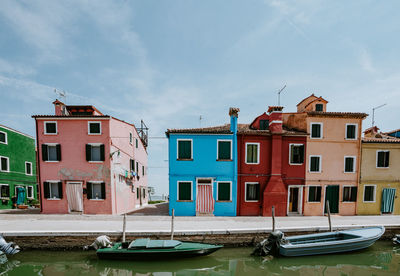 Residential buildings against blue sky