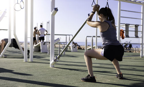Full length of woman with arms outstretched