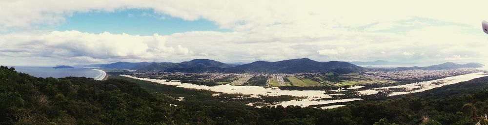 Scenic view of mountains against cloudy sky