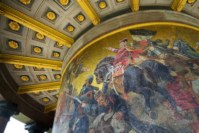 Low angle view of patterned ceiling of building