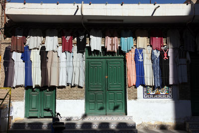 Low angle view of clothes hanging on street