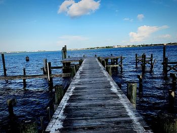 Pier over sea against sky