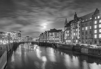 Illuminated buildings in water