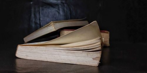 Three books on a black background