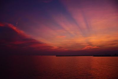 Scenic view of sea against orange sky