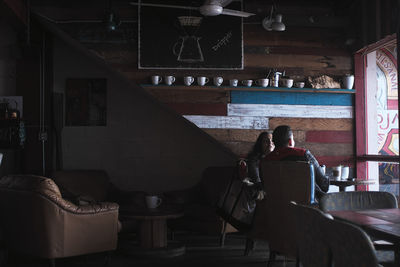 People relaxing on table at home