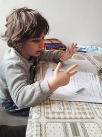 Boy holding paper