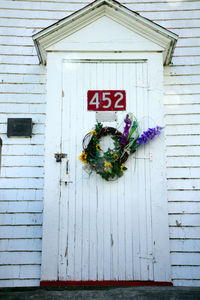 Potted plant on door of building