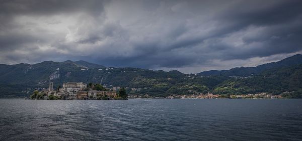 Scenic view of mountains against cloudy sky