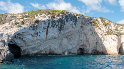 Panoramic view of rocks in sea against sky