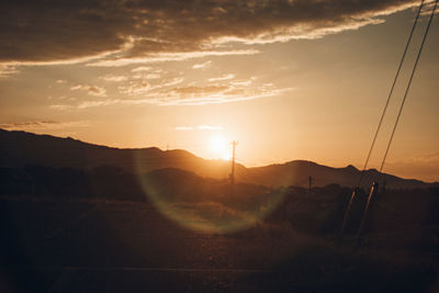 Scenic view of mountains against sky during sunset