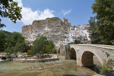 Bridge over the river in the rustic town, colors of summer