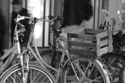 Close-up of bicycles parked in city