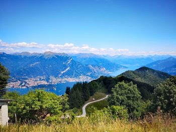 Scenic view of mountains against blue sky