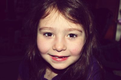 Close-up portrait of smiling girl