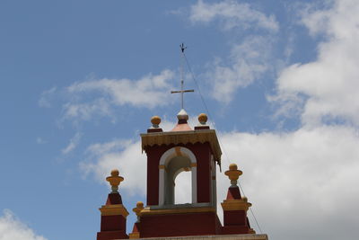 Low angle view of bell tower against sky