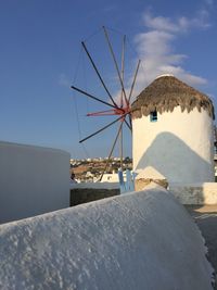 Traditional windmill against sky