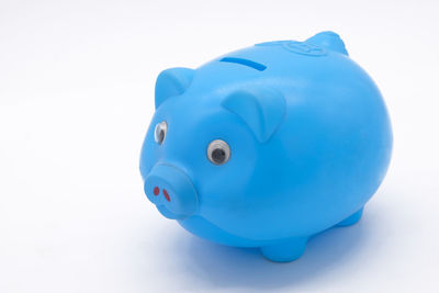 Close-up of blue toy against white background