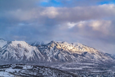 Scenic view of snowcapped mountains against sky