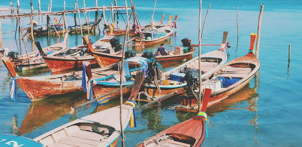 Fishing boats moored at harbor