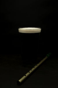 Close-up of coffee on table against black background