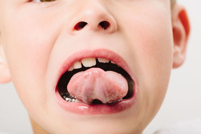Close-up of boy with baby in mouth