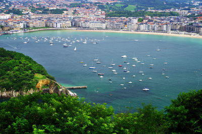 High angle view of city by sea